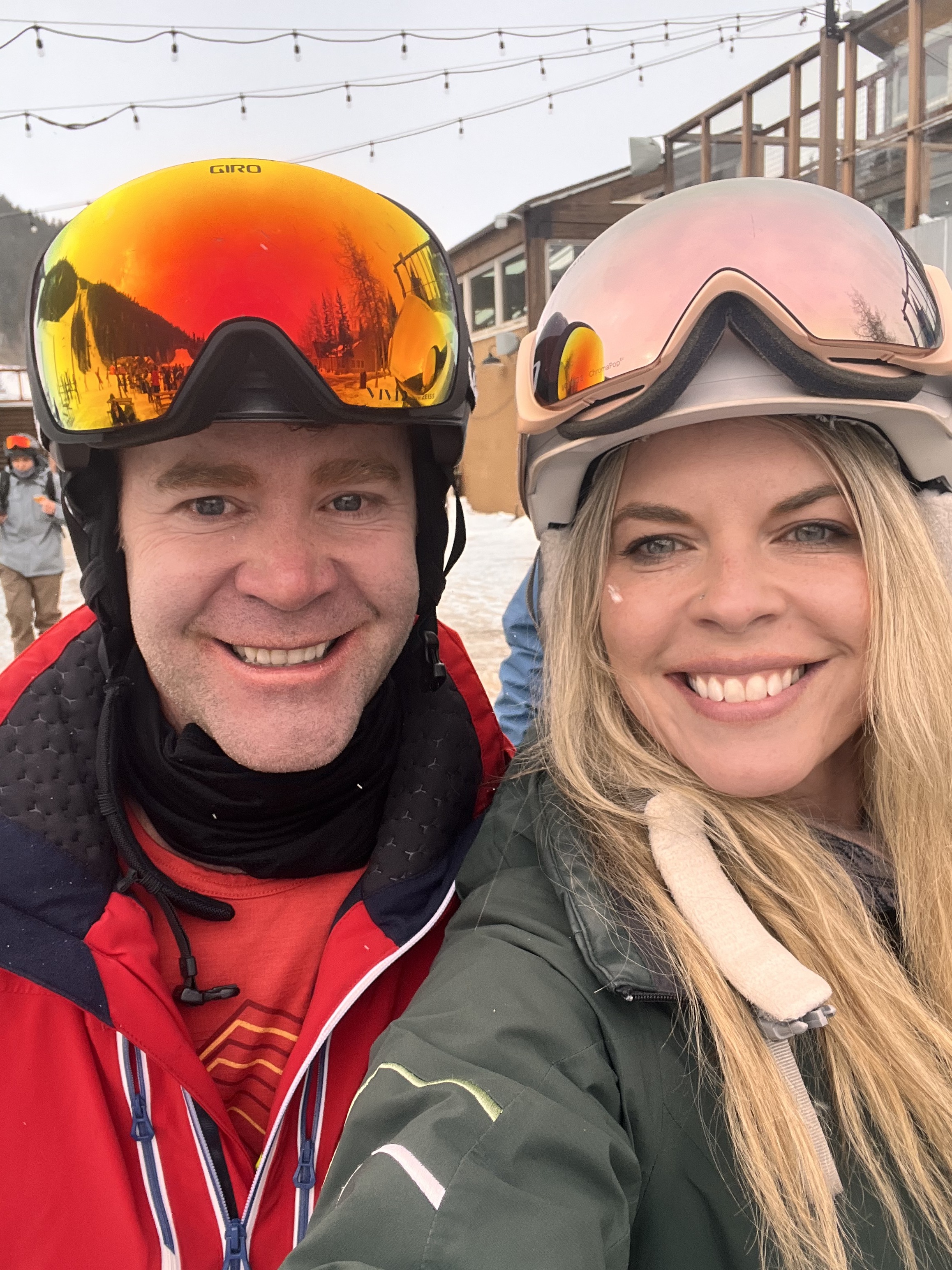 Jordan and Donny smiling in ski gear at a Colorado mountain resort
