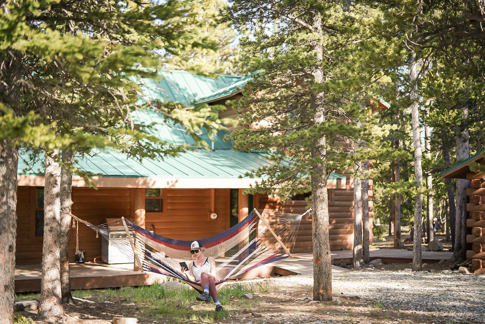 The lodge tucked into eight acres of pine forest with a hammock in the sunny clearing