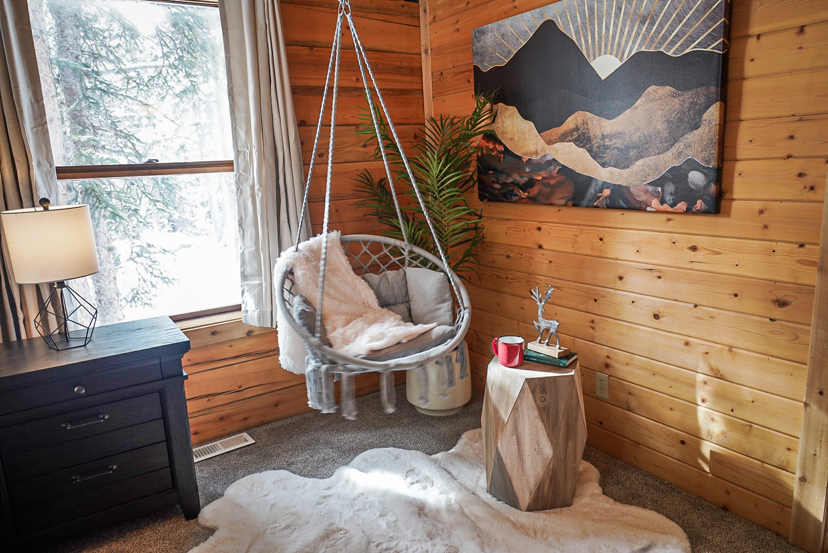Hanging rope chair and reading nook in the primary suite